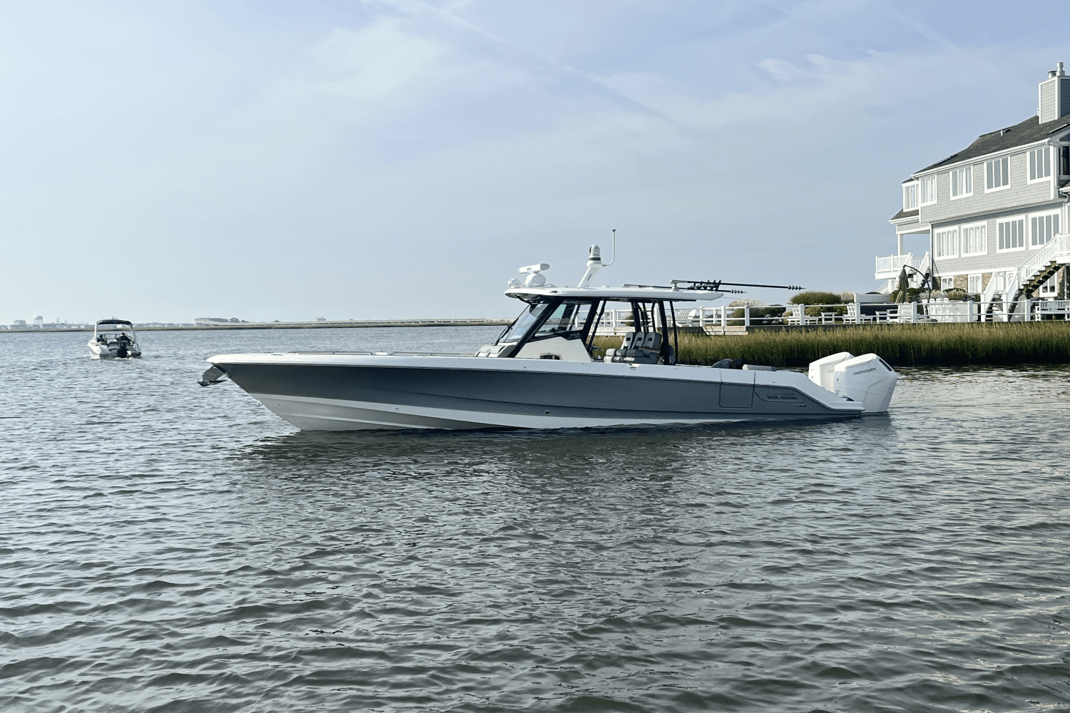 Premium Photo  Aluminum blue fishing boat with a motor near the lake shore  fishing active recreation